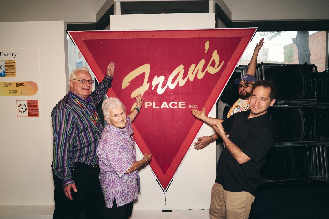 TRL team in front of Frans sign - photo credit Ferns Francois Four members of United Lynn Pride pose joyfully in front of a replica of the sign of "Fran's Place" a gay bar in Lynn